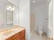 Bathroom featuring double sinks, granite counters and a tub and shower combination at 506 Golfpark Dr, Celebration, FL 34747
