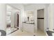 Elegant bathroom with a vanity, framed mirror, and tile floors offering a clean and luxurious space at 506 Golfpark Dr, Celebration, FL 34747