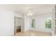 Bedroom featuring bright white walls and ceilings plus an entrance to the bathroom at 506 Golfpark Dr, Celebration, FL 34747