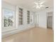 Bright bedroom with built-in shelves, large windows providing natural light at 506 Golfpark Dr, Celebration, FL 34747
