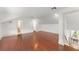 Large bedroom with hardwood floors and access to bathroom and staircase at 506 Golfpark Dr, Celebration, FL 34747