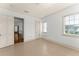 Spacious bedroom featuring bright white walls and ceilings, with views of the exterior at 506 Golfpark Dr, Celebration, FL 34747