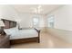 Cozy bedroom with classic decor, ceiling fan, and plenty of natural light at 506 Golfpark Dr, Celebration, FL 34747