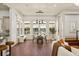 Bright dining room features abundant natural light and access to the kitchen at 506 Golfpark Dr, Celebration, FL 34747
