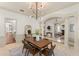 Open concept dining area with stylish columns, fireplace and elegant décor at 506 Golfpark Dr, Celebration, FL 34747