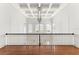 Hallway boasting coffered ceilings, modern lighting, and hardwood floors at 506 Golfpark Dr, Celebration, FL 34747