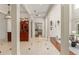 Grand hallway featuring architectural columns, hardwood floors, and access to various rooms at 506 Golfpark Dr, Celebration, FL 34747