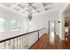 Hallway boasting coffered ceilings, modern lighting, and hardwood floors at 506 Golfpark Dr, Celebration, FL 34747