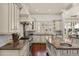 Gourmet kitchen featuring custom cabinets, a large island, and stainless steel appliances at 506 Golfpark Dr, Celebration, FL 34747