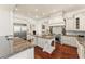 Gourmet kitchen with granite countertops, custom cabinetry, and stainless steel appliances at 506 Golfpark Dr, Celebration, FL 34747