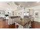 Open kitchen featuring a large island with a prep sink, stainless steel appliances, and great flow to living areas at 506 Golfpark Dr, Celebration, FL 34747