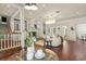 Spacious living room with hardwood floors, a fireplace, and elegant furnishings for comfortable living at 506 Golfpark Dr, Celebration, FL 34747