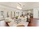Open living space with hardwood floors and views into the gourmet kitchen at 506 Golfpark Dr, Celebration, FL 34747