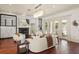 Inviting living room with a fireplace, built-ins, and views of the pool through French doors at 506 Golfpark Dr, Celebration, FL 34747