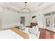 Spacious main bedroom with modern decor, a lounge area, and access to outdoor views at 506 Golfpark Dr, Celebration, FL 34747