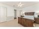 Well-lit main bedroom featuring neutral colors and classic furniture at 506 Golfpark Dr, Celebration, FL 34747