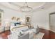 A luxurious main bedroom boasts modern lighting, stylish decor, and a spa-like ensuite bathroom at 506 Golfpark Dr, Celebration, FL 34747