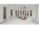 Outdoor patio area with multiple seating arrangements and ceiling fans at 506 Golfpark Dr, Celebration, FL 34747
