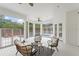 Elegant outdoor patio with ceiling fan and views of the pool at 506 Golfpark Dr, Celebration, FL 34747