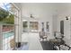 Elegant outdoor patio with brick columns and views of the pool at 506 Golfpark Dr, Celebration, FL 34747