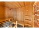 Inviting sauna with wood paneling, built-in benches, and a display of salt rocks and a ceiling with starry lights at 506 Golfpark Dr, Celebration, FL 34747