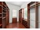 Spacious walk-in closet with ample shelving and storage solutions for organization and convenience at 506 Golfpark Dr, Celebration, FL 34747