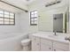 Well-lit bathroom with white tile, a single sink vanity, and a shower-tub combo at 520 Via Verona Ln # 202, Altamonte Springs, FL 32714
