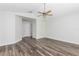Bright bedroom with wood floors, a ceiling fan, and access to other areas of the house at 520 Via Verona Ln # 202, Altamonte Springs, FL 32714
