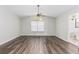 Spacious bedroom showcasing wood floors, a ceiling fan, and a large window for ample light at 520 Via Verona Ln # 202, Altamonte Springs, FL 32714