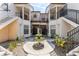 Serene courtyard with a fountain and lush landscaping, creating a peaceful atmosphere at 520 Via Verona Ln # 202, Altamonte Springs, FL 32714