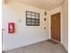 Exterior shot of the unit's front door with a security window and lock at 520 Via Verona Ln # 202, Altamonte Springs, FL 32714