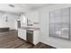 Efficient kitchen with laminate flooring, modern dishwasher, and natural light at 520 Via Verona Ln # 202, Altamonte Springs, FL 32714