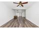 Bright living room with wood floors, ceiling fan, and ample space for seating arrangements at 520 Via Verona Ln # 202, Altamonte Springs, FL 32714