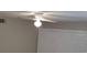 Bedroom with a ceiling fan, closet, light gray walls, and a window at 5267 Images Cir # 102, Kissimmee, FL 34746