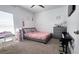 Bright bedroom with bed, desk, piano keyboard, dresser, and a cozy atmosphere at 542 Pine Tree Bridge Trl, St Cloud, FL 34772