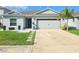 Charming single-story home featuring a well-manicured lawn and a two-car garage, located in a friendly neighborhood at 542 Pine Tree Bridge Trl, St Cloud, FL 34772