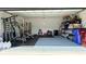 Spacious garage with work out equipment, storage solutions, and ample room at 542 Pine Tree Bridge Trl, St Cloud, FL 34772