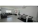 Open-concept living space showcasing both the living room and dining area with cohesive, modern decor at 542 Pine Tree Bridge Trl, St Cloud, FL 34772