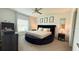 Relaxing main bedroom featuring a unique round bed, neutral tones, and ample natural light at 542 Pine Tree Bridge Trl, St Cloud, FL 34772