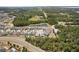 Scenic aerial shot featuring homes near lush green spaces, pond, and the surrounding community at 5457 Carrara Ct, St Cloud, FL 34771