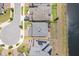 Aerial view of the home featuring a well-manicured backyard, patio, and nearby pond at 5457 Carrara Ct, St Cloud, FL 34771