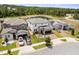 Expansive aerial view of a two-story home in a well-planned community with pond views at 5457 Carrara Ct, St Cloud, FL 34771