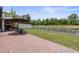A large backyard featuring patio furniture and a great view of the pond at 5457 Carrara Ct, St Cloud, FL 34771