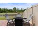Backyard patio has outdoor seating area with a gas fire pit at 5457 Carrara Ct, St Cloud, FL 34771