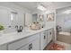 Elegant bathroom with double sink vanity, marble countertop, and modern fixtures at 5457 Carrara Ct, St Cloud, FL 34771