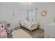 Cozy bedroom with neutral colors and natural lighting, perfect for relaxation at 5457 Carrara Ct, St Cloud, FL 34771