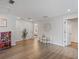 Spacious bonus room, great for entertainment or play, with hardwood floors and natural lighting at 5457 Carrara Ct, St Cloud, FL 34771