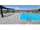 Gorgeous community pool with plenty of lounge chairs and views of the adjacent lake at 5457 Carrara Ct, St Cloud, FL 34771