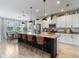 Modern kitchen with granite countertops, stainless steel appliances, and large island at 5457 Carrara Ct, St Cloud, FL 34771