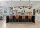 Elegant kitchen with granite countertops, pendant lighting, and stylish bar stool seating at 5457 Carrara Ct, St Cloud, FL 34771